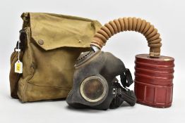 A WORLD WAR TWO ERA GAS MASK, two piece in its Carrying canvas bag. The Bag is marked Maple 1941