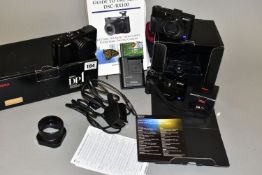 A BOXED SIGMA DP1 DIGITAL CAMERA with charger, cable, four batteries, a HA11 hood and a VF-11 view