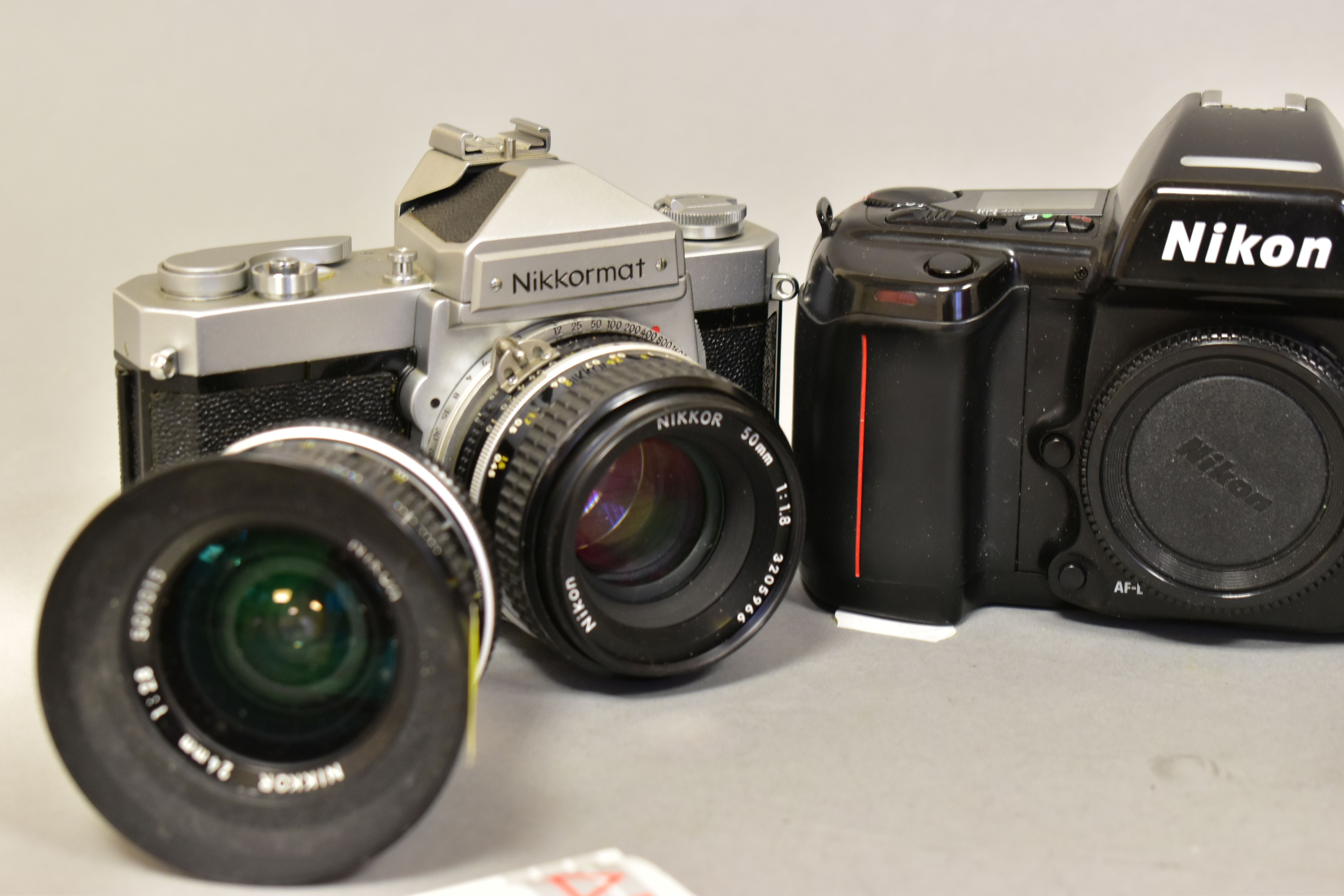 A NIKKORMAT FT FILM SLR CAMERA fitted with a 50mm f1.8 lens, a 24mm f2.8 lens, a F90 film SLR - Image 2 of 4