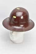 A CIVIL DEFENCE WORLD WAR TWO 'ZUCKERMANN' HELMET, painted brown over base metal, marked AMC 1941(