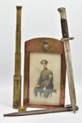 A FRAMED PHOTO OF WORLD WAR ONE SOLDIER WITH TWO OTHER MILITARY ITEMS, as follows, a copper