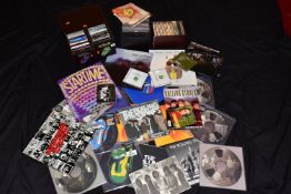 FOURTEEN 10in SINGLES, BOOKS, BOXSETS, A CASE OF SINGLES AND A CASE OF 38CDs BY THE ROLLING STONES