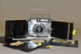 A PLAUBEL MAKINA 2S FILM CAMERA with a Anticomat 10cm f2.9 lens and a Rado film back