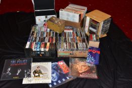 THREE TRAYS AND A CAROUSEL CONTAINING OVER FIFTY LPs AND ONE HUNDRED CDs from artists such as The