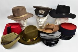 A BOX CONTAINING A NUMBER OF MILITARY STYLE HATS, CAPS to include East German post WWII, another