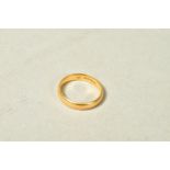 A 22CT GOLD BAND RING, of plain design, with 22ct hallmark, width 4mm, ring size P 1/2,