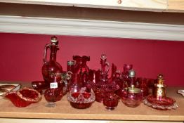 A GROUP OF CRANBERRY GLASS ITEMS, including a footed jug having Mark W MFM with cranberry insert,