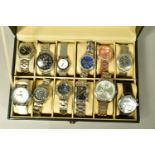 A WATCH DISPLAY CASE WITH WATCHES, a black and glass panelled watch display case with twelve watches