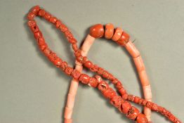 TWO CORAL NECKLACES, the first designed as a long necklace of graduated coral beads, the second