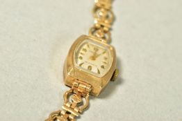 A 9CT GOLD WATCH HEAD, the Premex watch with white face, Arabic numeral and baton hour markers, head