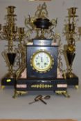 A LATE 19TH CENTURY BLACK SLATE, MARBLE AND GILT METAL CLOCK GARNITURE, the clock with urn shaped