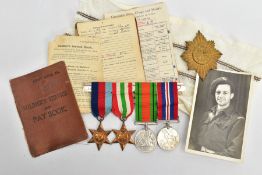 A GROUP OF FOUR WORLD WAR TWO MEDALS, including the 1939-45,Italy Stars, Defence & War Medal on a