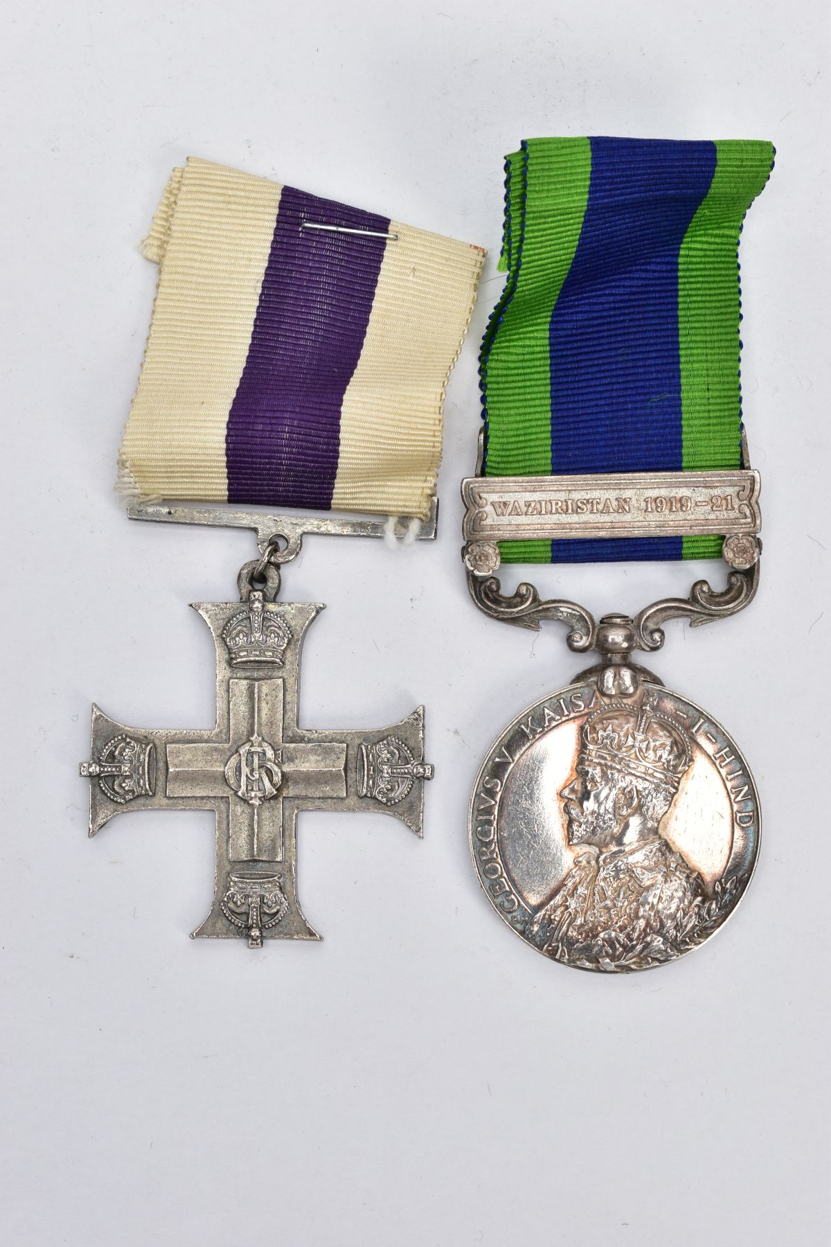 AN INDIA GENERAL SERVICE MEDAL 1909 AND A REPRODUCTION GEO V MILITARY CROSS, the GSM is named 2631