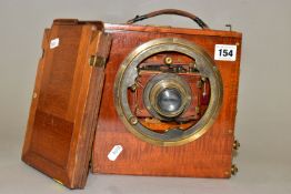 A THORNTON PICKARD THE SANDERSON PLATE CAMERA in mahogany and brass fitted with a Taylors series 3