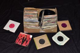 A TRAY CONTAINING APPROX TWO HUNDRED AND FIFTY 7in SINGLES artists include Elvis Presley, Simon