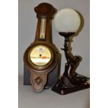 AN OAK ANEROID WHEEL BAROMETER, having mercury Fahrenheit and centigrade thermometer by Barker &