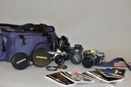 FOUR OLYMPUS CAMERAS comprising of an OM-1N in black fitted with an auto s 50mm f1.8 lens, an OM-