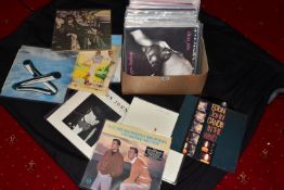 A TRAY CONTAINING OVER FIFTY LPs AND 12in SINGLES by artists such as Elton John, Rod Stewart,