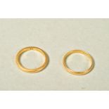 TWO 22CT GOLD BAND RINGS, both of plain design, both with 22ct hallmarks, widths 2mm, ring sizes K