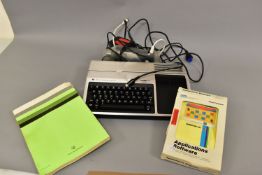 A TEXAS INTRUMENTS TI-99 4A VINTAGE PERSONAL COMPUTER with power supply, PHA 2036 modulator,