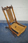 A 19TH CENTURY WALNUT ECCLESIASTICAL FOLDING CAMPAIGN CHAIR, with a rush seat and back (