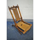 A 19TH CENTURY WALNUT ECCLESIASTICAL FOLDING CAMPAIGN CHAIR, with a rush seat and back (