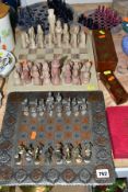 A GROUP OF GAMES AND TOYS, CHESS SETS, DARTS, DOMINOES AND DICE, comprising four chess boards