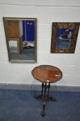 A REPRODUCTION MAHOGANY OCCASIONAL TABLE, the wavy dish top on triple turned supports, tripod legs