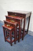 A RED LAQUERED ORIENTAL QUARTETTO NEST OF THREE TABLES, with chinoiserie decoration, and a single