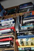 BOOKS, approximately 110 titles in four boxes mostly concerning cars and motorsport but includes