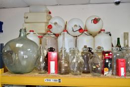 A LARGE COLLECTION OF WINE MAKING EQUIPMENT, to include over 30 clear and brown glass demijohns, a