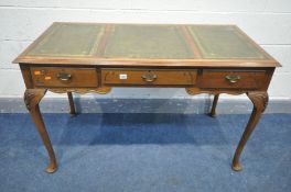 A REPRODUCTION VICTORIAN STYLE WRITING TABLE, with a triple gilt tooled and green leather inlay