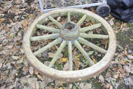 A VINTAGE CARTWHEEL, diameter 95cm together with a metal and wheeled BBQ, width with handle 100cm
