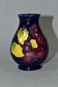 A SMALL MOORCROFT POTTERY VASE, Clematis pattern on blue ground, faint backstamp to base, height 9.
