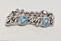 A BLUE TOPAZ CHAIN BRACELET, white metal curb chain bracelet with three circular cut topaz stones in