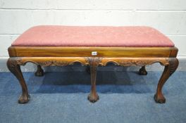 A REPRODUCTION VICTORIAN STYLE MAHOGANY DUET STOOL, with a pine upholstered drop in seat pad, on