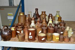 APPROXIMATELY SIXTY STONEWARE BOTTLES AND POTS, to include a J Graf Stoob Austrian stoneware