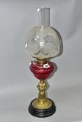 A LATE VICTORIAN BRASS BASED OIL LAMP, the domed acid etched clear and opaque shade above a
