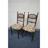 IN THE MANNER OF WILLIAM BIRCH, a pair of Arts and Crafts oak chairs