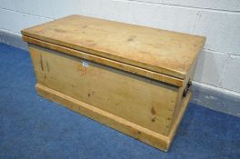 A PINE BLANKET CHEST with twin iron drop handles, width 98cm x depth 47cm x height 48cm (