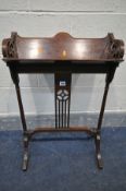 AN EDWARDIAN MAHOGANY AND INLAID BOOKSTAND, open fretwork ends, on twin turned supports and