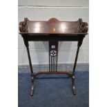 AN EDWARDIAN MAHOGANY AND INLAID BOOKSTAND, open fretwork ends, on twin turned supports and