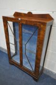 AN ART DECO WALNUT TWO DOOR CHINA CABINET with two glass shelves, width 91cm x depth 31cm x height