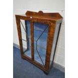 AN ART DECO WALNUT TWO DOOR CHINA CABINET with two glass shelves, width 91cm x depth 31cm x height