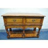 A REPRODUCTION OAK SIDEBOARD, with two frieze drawers, turned and block front legs united by an