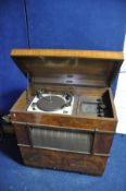 A R.G.D VALVE RADIOGRAM in walnut Art Deco style cabinet with a Garrard R.C 80M turntable (PAT