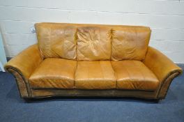 A BROWN LEATHER AND BUTTONED THREE SEATER SOFA, length 213cm (condition:-ink stains)