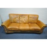 A BROWN LEATHER AND BUTTONED THREE SEATER SOFA, length 213cm (condition:-ink stains)