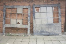 TWO VINTAGE WOODEN BLACK PAINTED GARAGE/BARN SLIDING DOORS on hanging rollers and twelve glass