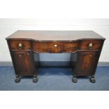 A GEORGE IV MAHOGANY PEDESTAL SIDEBOARD, with one short and two long frieze drawers, with brass